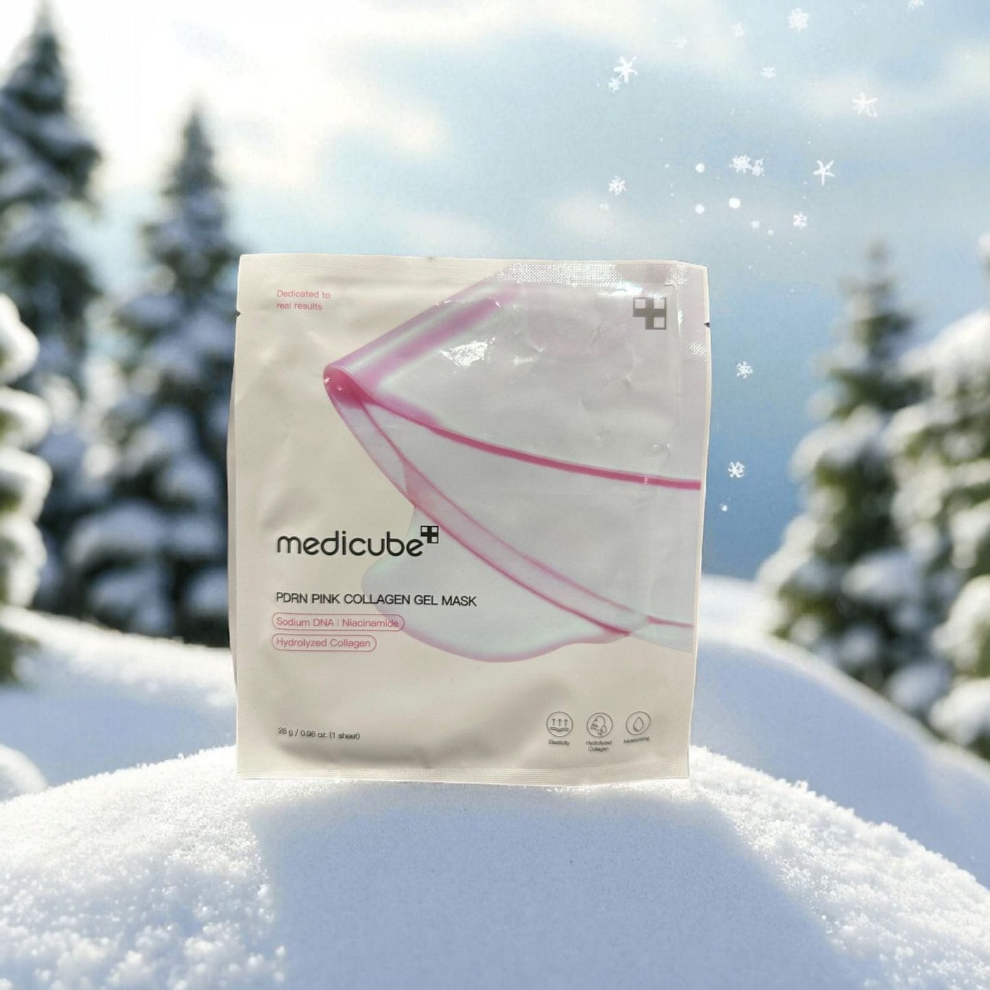 Medicube pink collagen gel mask packaging on a snowy background